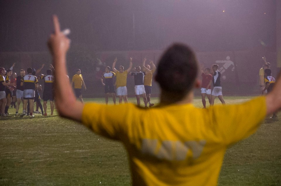 U.S. Sailors and Marines assigned to the amphibious assault ship USS America (LHA 6) celebrate during a rugby game against the Peruvian Navy in Callao, Peru, Sept 140901-N-MZ309-623