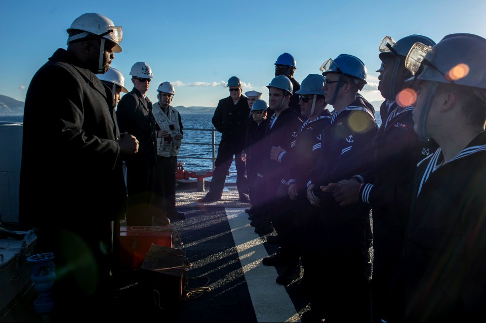 U.S. Sailors hold a safety brief aboard the guided missile cruiser USS Philippine Sea (CG 58) before setting anchor in Piraeus, Greece, for a scheduled liberty port visit March 4, 2014 140304-N-PJ969-102