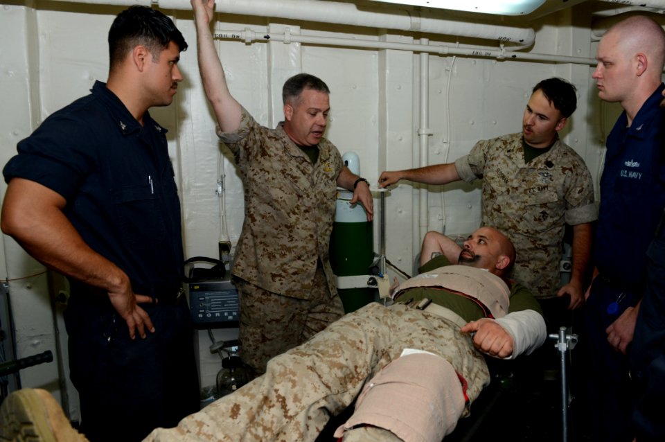 U.S. Sailors review procedures after participating in a mass casualty drill aboard the amphibious transport dock ship USS Mesa Verde (LPD 19) in the Arabian Sea April 9, 2014 140409-N-BD629-006
