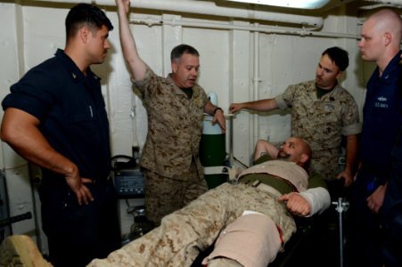 U.S. Sailors review procedures after participating in a mass casualty drill aboard the amphibious transport dock ship USS Mesa Verde (LPD 19) in the Arabian Sea April 9, 2014 140409-N-BD629-006