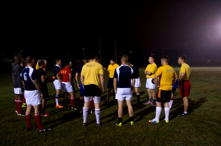 U.S. Sailors and Marines assigned to the amphibious assault ship USS America (LHA 6) and Peruvian sailors prepare to play rugby in Callao, Peru, Sept 140901-N-MZ309-065