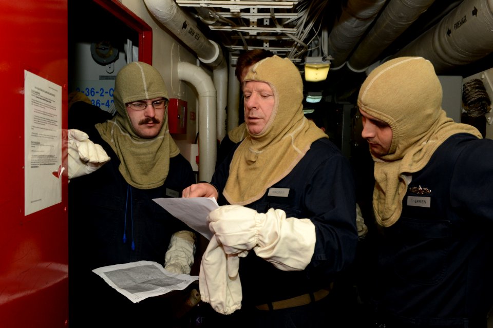 U.S. Sailors participate in a general quarters drill aboard the amphibious transport dock ship USS Mesa Verde (LPD 19) in the Mediterranean Sea Feb. 27, 2014 140227-N-BD629-059
