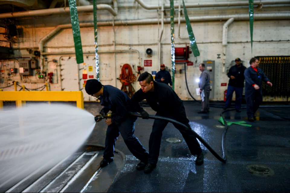 U.S. Sailors aboard the amphibious transport dock ship USS Mesa Verde (LPD 19) test an aqueous film-forming foam station during the ship's Board of Inspection and Survey (INSURV) evaluation Jan. 16, 2014, in 140116-N-BD629-302