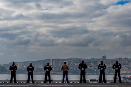 U.S. Sailors and Marines man the rails as the amphibious assault ship USS America (LHA 6) leaves Valparaiso, Chile, Aug. 27, 2014 140827-N-MZ309-042