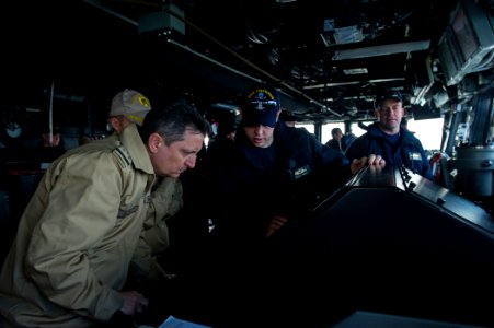 U.S. Sailors assigned to the guided missile destroyer USS Truxtun (DDG 103) work alongside Romanian sailors on the ship's bridge while underway in the Bosphorus strait March 7, 2014 140307-N-EI510-115