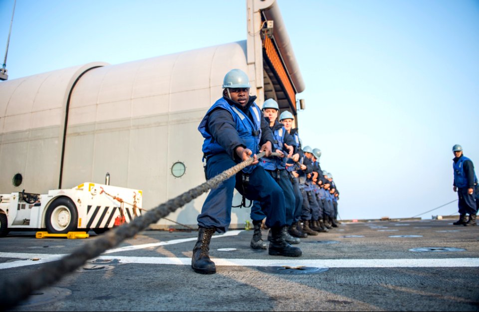 U.S. Sailors assigned to the amphibious transport dock ship USS Denver (LPD 9) tow a line while conducting a replenishment at sea with the fleet replenishment oiler USNS Rappahannock (T-AO 204) in the East China 140327-N-ZU025-032