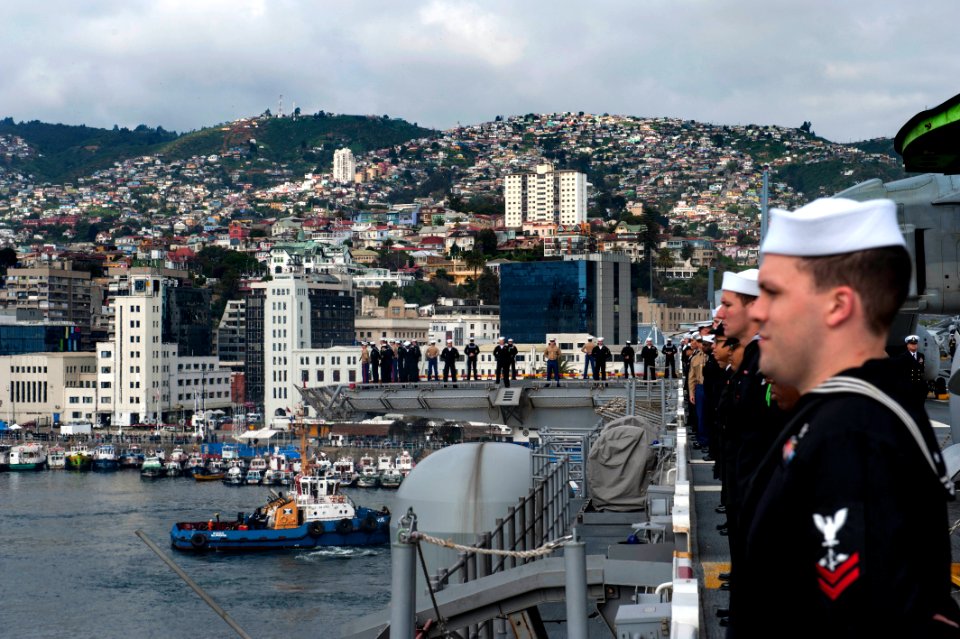 U.S. Sailors and Marines man the rails as the amphibious assault ship USS America (LHA 6) departs Valparaiso, Chile, Aug. 27, 2014, after a three-day port visit 140827-N-MZ309-052