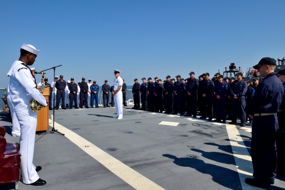 U.S. Sailors assemble on the fantail aboard the guided missile destroyer USS Ross (DDG 71) in the Black Sea during a 9-11 remembrance ceremony Sept 140911-N-IY142-023