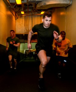 U.S. Sailors and Marines commemorate the Bataan Death March by running 63 laps up and down the ramp from the hangar bay to the flight deck aboard the amphibious assault ship USS Bataan (LHD 5) in the Gulf 140409-N-MW280-158
