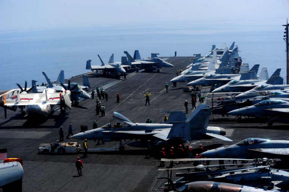 U.S. Sailors move aircraft aboard the aircraft carrier USS George H.W. Bush (CVN 77) Sept 140902-N-CZ979-003