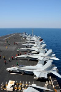 U.S. Sailors perform maintenance on aircraft Sept 140929-N-MU440-045