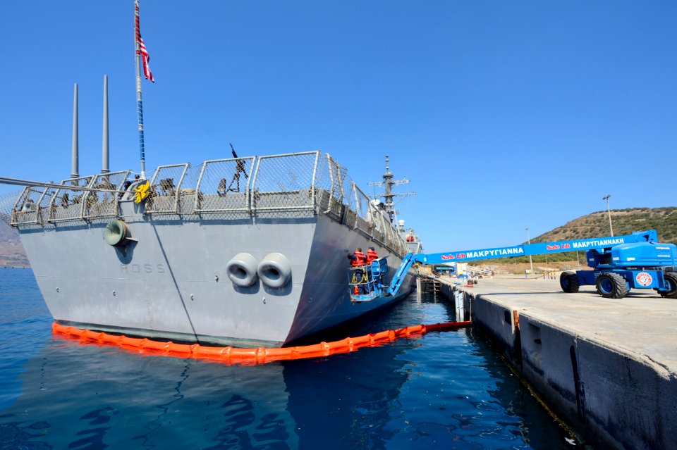 U.S. Sailors paint the side of the guided missile destroyer USS Ross (DDG 71) Aug. 26, 2014, during a scheduled port visit to Naval Support Activity Souda Bay, Greece 140826-N-IY142-424