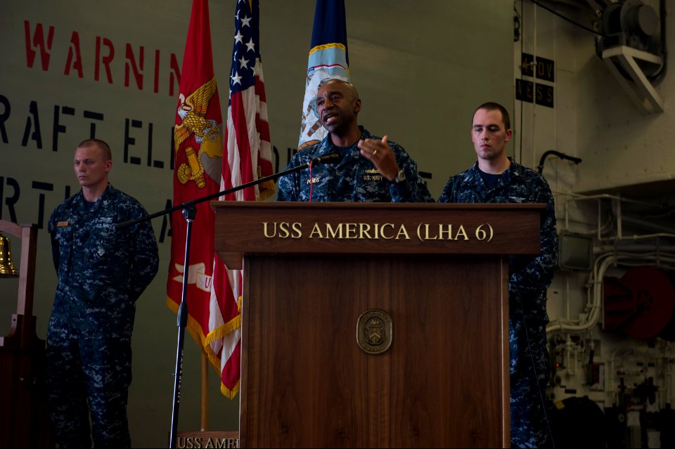 U.S. Navy Rear Adm. Frank L. Ponds, center, the commander of Expeditionary Strike Group 3, gives closing remarks during a 9-11 remembrance ceremony aboard the newly commissioned amphibious assault ship USS 140911-N-MD297-135