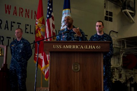 U.S. Navy Rear Adm. Frank L. Ponds, center, the commander of Expeditionary Strike Group 3, gives closing remarks during a 9-11 remembrance ceremony aboard the newly commissioned amphibious assault ship USS 140911-N-MD297-135
