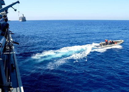 U.S. Sailors assigned to the guided missile destroyer USS Ramage (DDG 61) conduct a passenger transfer in a rigid-hull inflatable boat in the Mediterranean Sea March 20, 2014 140320-N-CH661-064