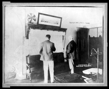 U.S. Secret Service Chief John E. Wilkie examining map in his office LCCN2002722613 photo