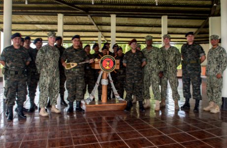 U.S. Sailors with Coastal Riverine Squadron (CORIVRON) 2 and Guatemalan Naval Infantry Force members pose for a group photo as part of their closing ceremony in Puerto Barrios, Guatemala, Aug. 21, 2014, during 140821-N-QY430-094