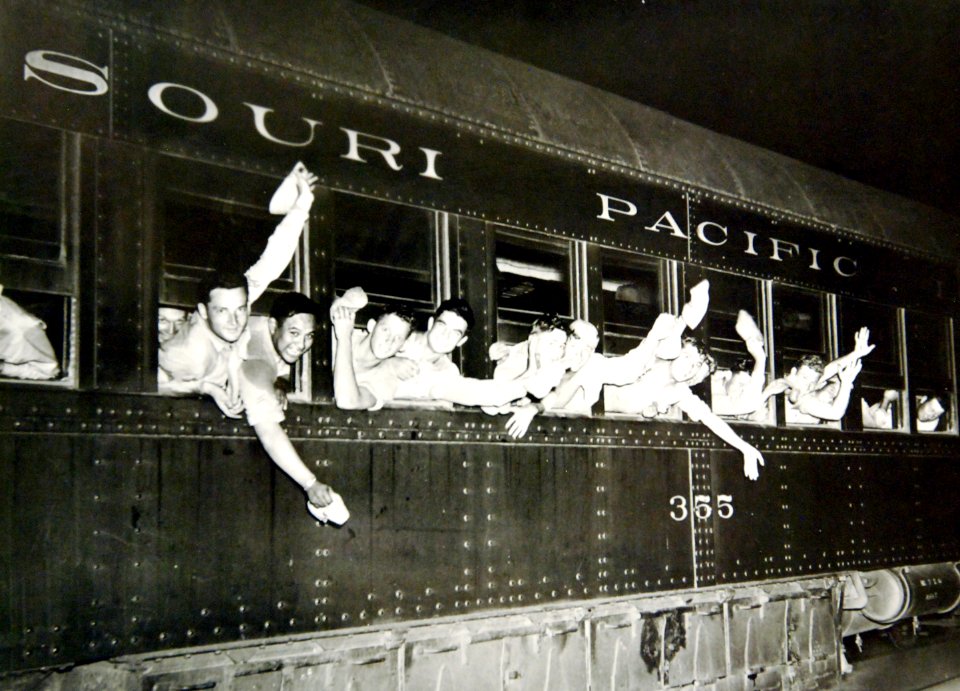 U.S. soldiers wave farewell, American troop train leaving a Midwestern U.S. military camp, WWII (34624799271)