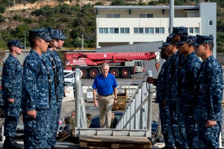 U.S. Sailors stand at attention aboard the guided missile destroyer USS Ramage (DDG 61) as Secretary of the Navy Ray Mabus boards the ship Nov. 15, 2013, at Naval Support Activity Souda Bay, Greece 131115-N-VC236-010