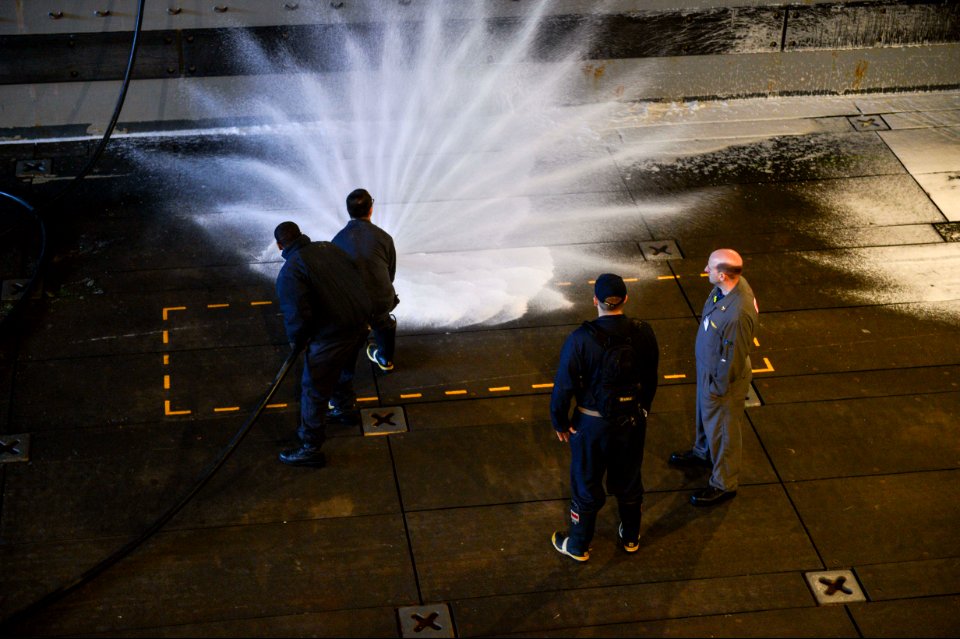 U.S. Sailors aboard the amphibious transport dock ship USS Mesa Verde (LPD 19) test an aqueous film-forming foam station during the ship's Board of Inspection and Survey (INSURV) evaluation Jan. 16, 2014, in 140116-N-BD629-314