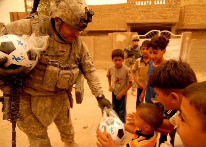 U.S. Soldiers pass out soccer balls DVIDS116291