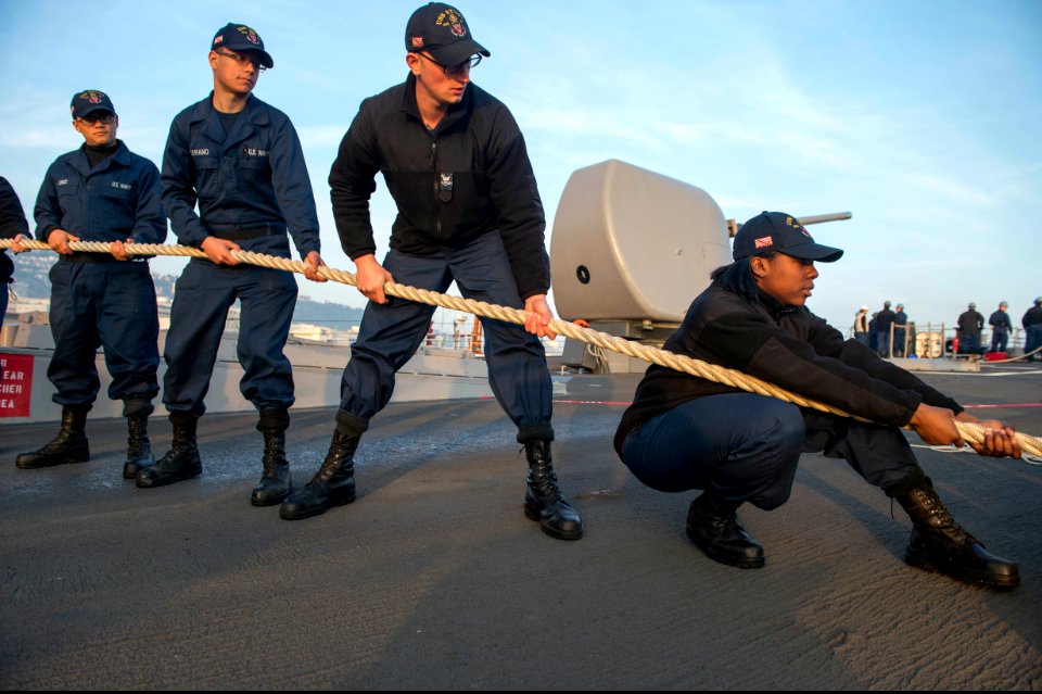U.S. Sailors aboard the guided missile destroyer USS Stout (DDG 55) heave mooring lines as the ship pulls into port in Haifa, Israel, Jan. 19, 2014, for a scheduled port visit 140119-N-UD469-503