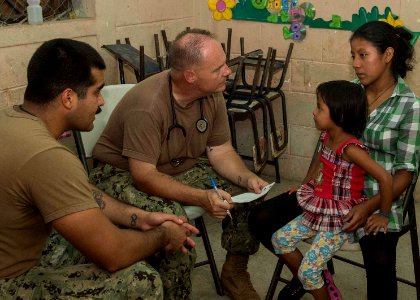 U.S. Service members tend to Guatemalan patients at a medical civic action project (MEDCAP) in Puerto Barrios, Guatemala, Aug. 23, 2014, during Southern Partnership Station (SPS) 2014 140823-N-QY430-511
