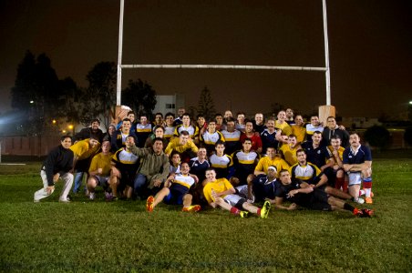 U.S. Sailors and Marines assigned to the amphibious assault ship USS America (LHA 6) pose for a photo with Peruvian sailors after a rugby game in Callao, Peru, Sept 140901-N-MZ309-666