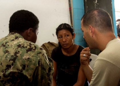 U.S. Service members tend to a Guatemalan patient at a medical civic action project (MEDCAP) in Puerto Barrios, Guatemala, Aug. 23, 2014, during Southern Partnership Station (SPS) 2014 140823-N-QY430-594