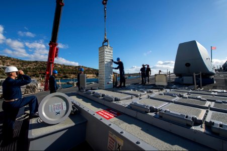 U.S. Sailors assigned to the guided missile destroyer USS Ramage (DDG 61) unload ordnance from the ship during a missile swap with the guided missile cruiser USS Monterey (CG 61), not shown, at Naval Support 131108-N-VC236-007