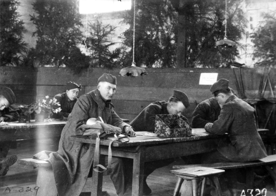 U.S. soldiers at writing tables in the American Red Cross Recreation Hut at Evacuation Hospital No.3, Trier, Germany, in February 1919 (anrc.00255)