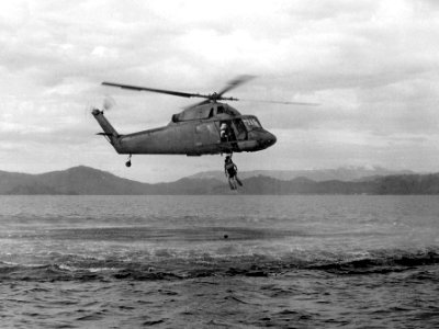 UH-2A Seasprite of HC-7 makes a practice recovery in Subic Bay, December 1969 (NNAM.2011.113.193)
