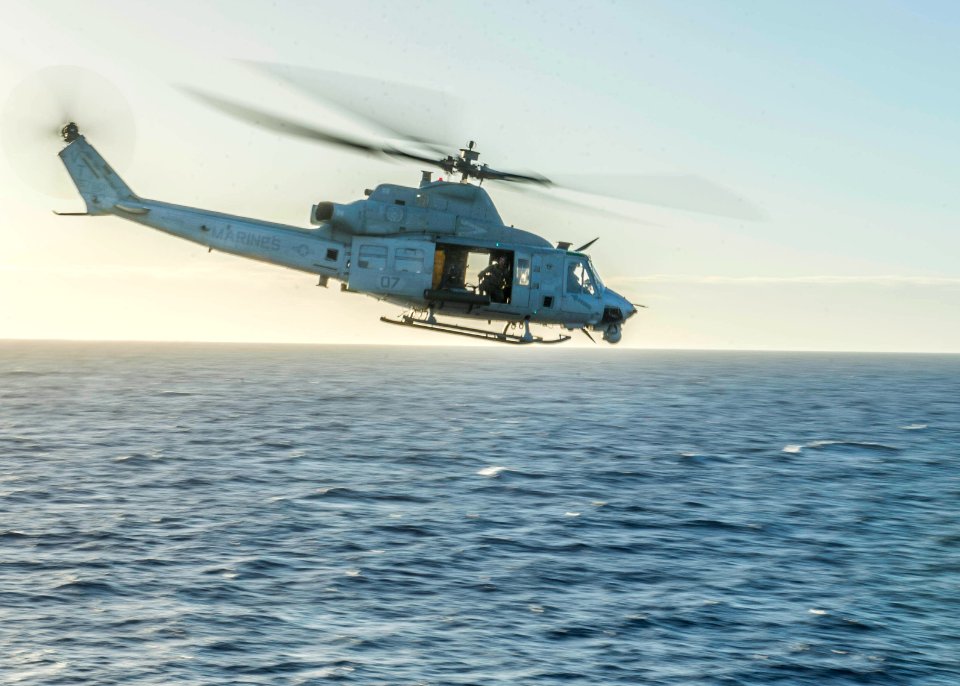 UH-1Y Venom helicopter departs USS Green Bay 150204-N-EI510-270
