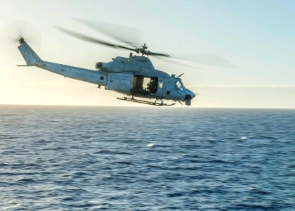 UH-1Y Venom helicopter departs USS Green Bay 150204-N-EI510-270