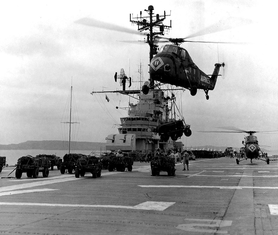 UH-34D lifts vehicle from USS Valley Forge (LPH-8) c1965
