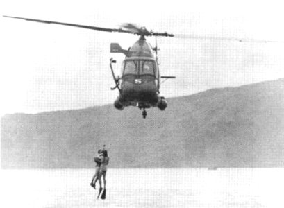 UH-2 Seasprite rescueing pilot during exercise in Subic Bay c1967 photo