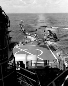 UH-2A Seasprite of HU-1 takes off from USS Columbus (CG-12) on 6 January 1965