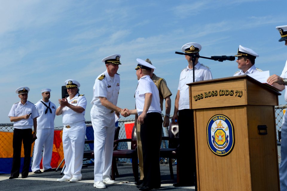 Ukrainian navy Vice Adm. Serhiy Hayduk, center right, the commander in chief of the Ukrainian Naval Forces, shakes hands with U.S. Navy Commodore James Aiken, the commander of Destroyer Squadron 60 and 140908-N-IY142-240