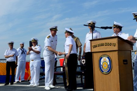 Ukrainian navy Vice Adm. Serhiy Hayduk, center right, the commander in chief of the Ukrainian Naval Forces, shakes hands with U.S. Navy Commodore James Aiken, the commander of Destroyer Squadron 60 and 140908-N-IY142-240