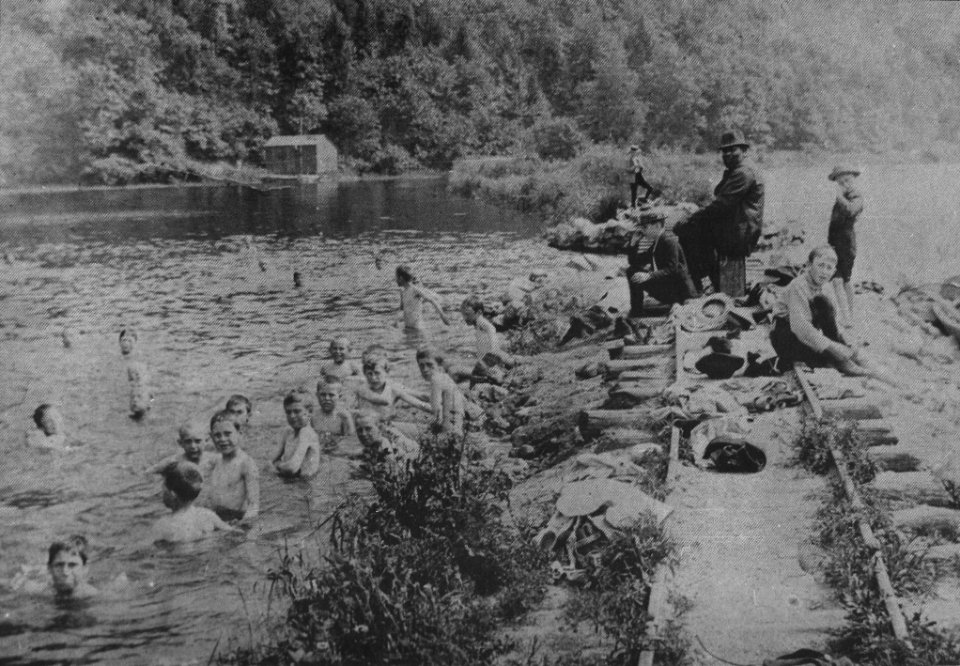 Uncle Abram Hallenback supervises swimming kids at Annaville Creek near Peekskill, New York
