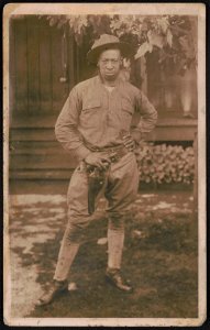 Unidentified African American soldier in uniform and campaign hat with handgun in holster LCCN2017648671 photo