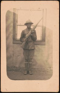 Unidentified African American soldier in uniform and helmet with rifle LCCN2017648680