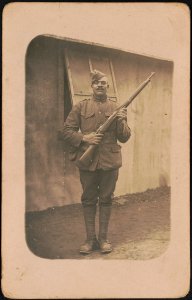 Unidentified African American soldier in uniform, cartridge belt, and overseas cap with rifle LCCN2017648677