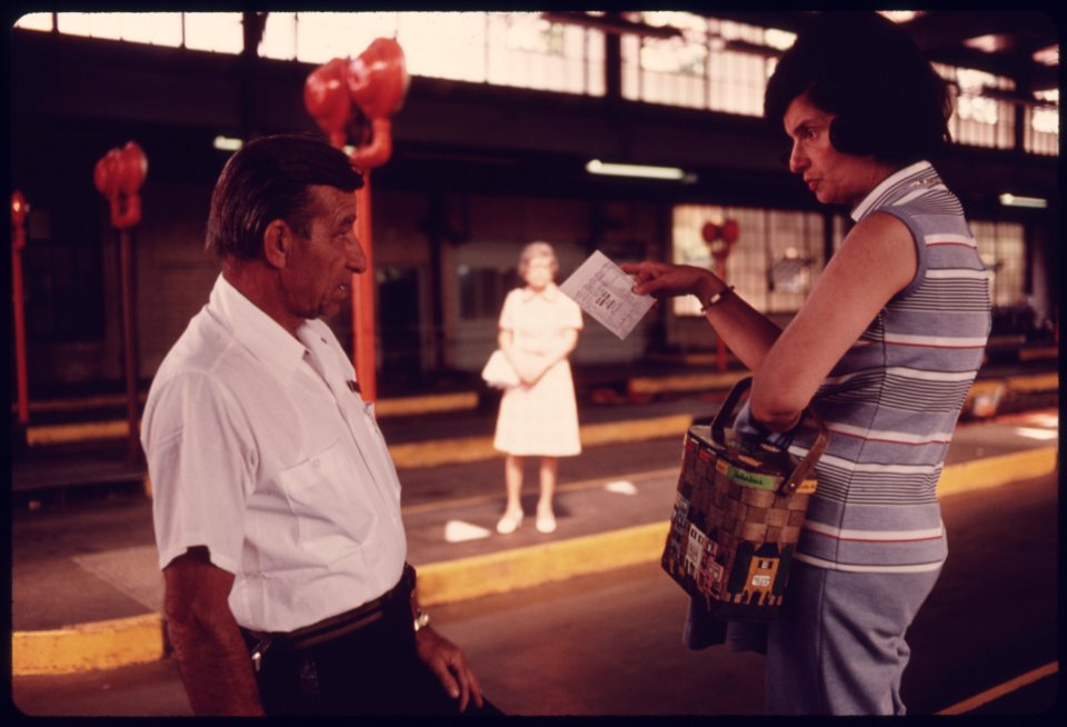 Unhappy Motorist, Right, Talks to a City Employee at an Auto Emission Inspection Station in Downtown Cincinnati, Ohio...09-1975 (4265794781)