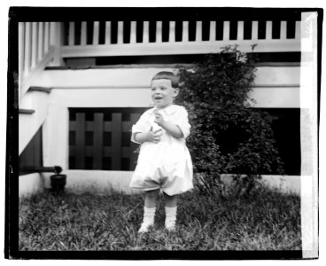 Unidentified child in front of porch LOC npcc.04226