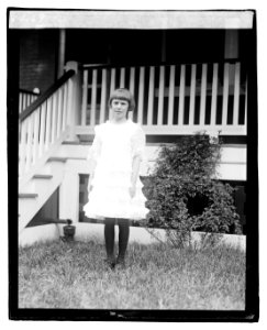 Unidentified child standing in front of porch LOC npcc.04225