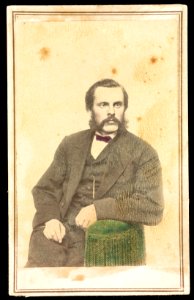 Unidentified bearded man, seated in green colored chair) - J .G. Stacy, Dover, Me LCCN2016653256