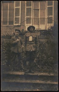 Unidentified African American prisoner-of-war in uniform and helmet with German soldier LCCN2017648702