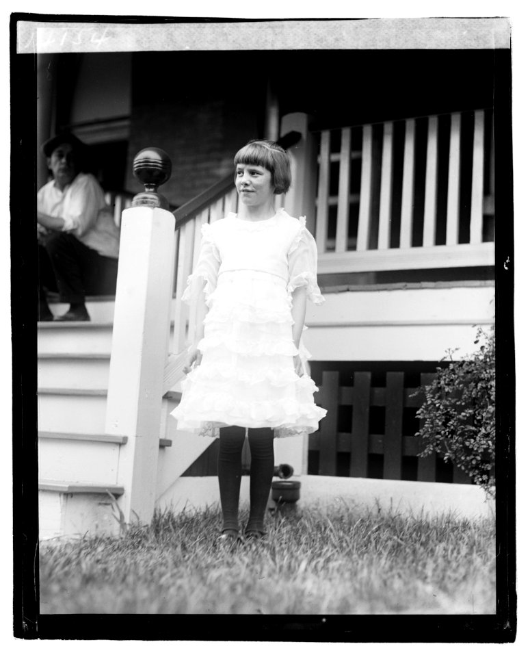 Unidentified girl standing in front of porch LOC npcc.04221