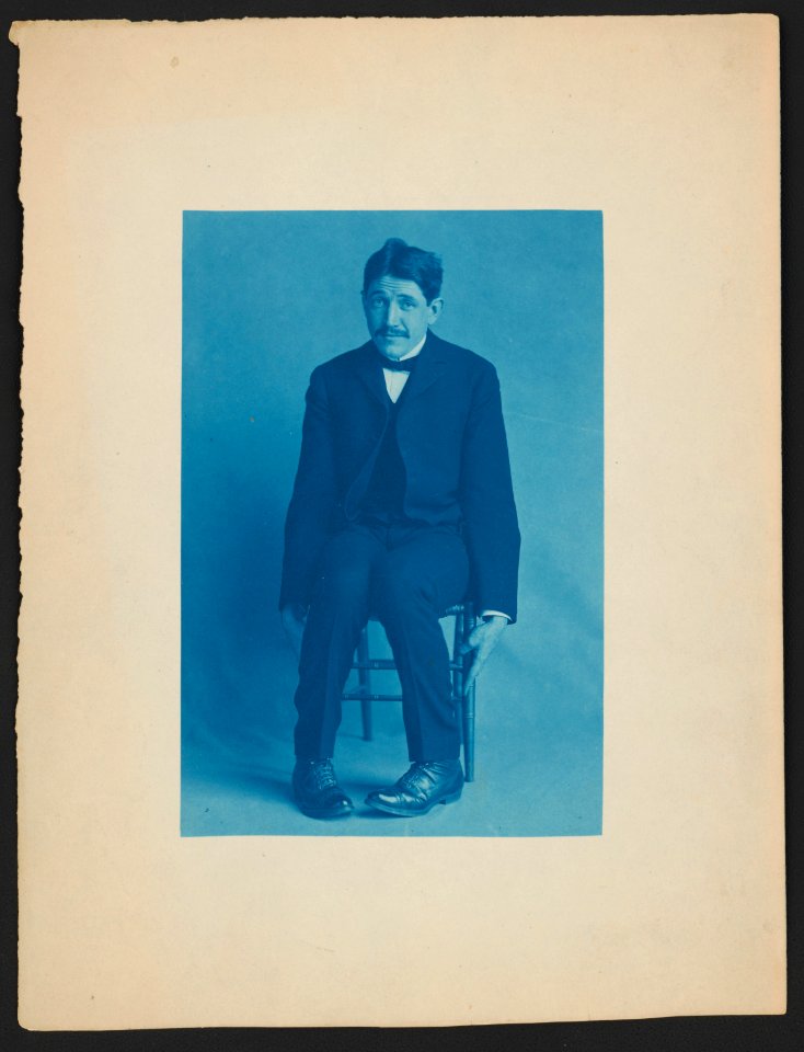 Unidentified friend of Frances Benjamin Johnston, seated, full length, facing front, leaning slightly forward LCCN2015647062